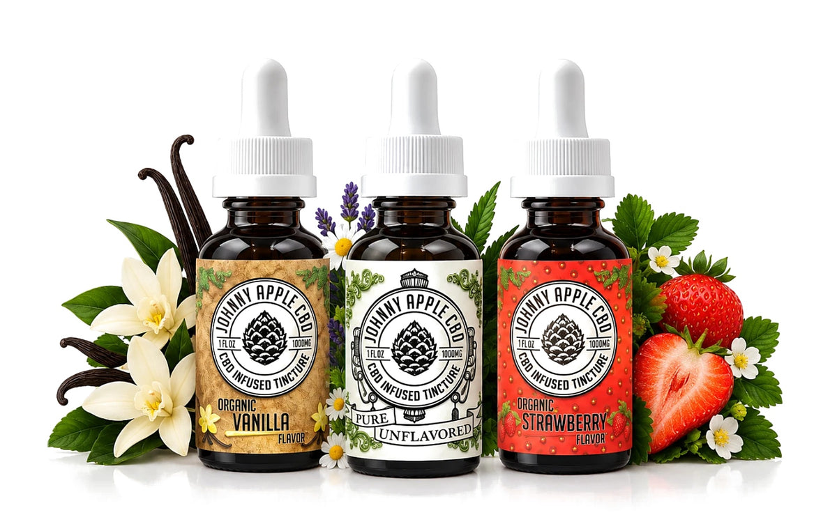 Three Johnny Apple CBD tincture bottles in vanilla, unflavored and strawberry with vanilla flowers, herbs and strawberries