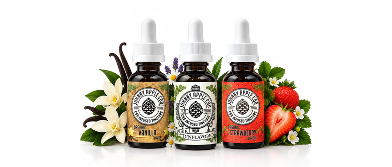 Three Johnny Apple CBD tincture bottles in vanilla, unflavored and strawberry with vanilla flowers, herbs and strawberries